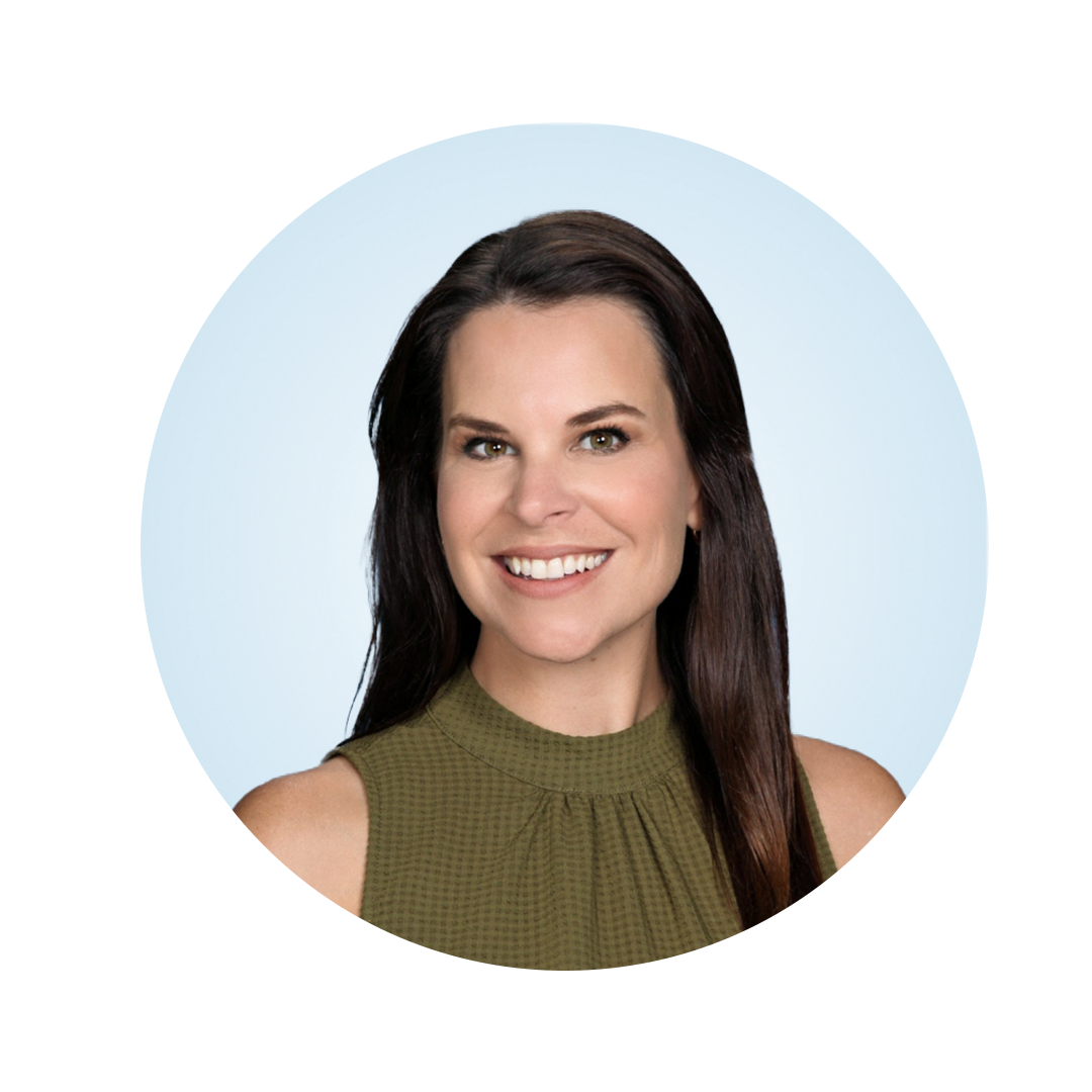 Head-and-shoulders portrait of a smiling woman with long dark brown hair, wearing a sleeveless green top, against a light blue circular background.